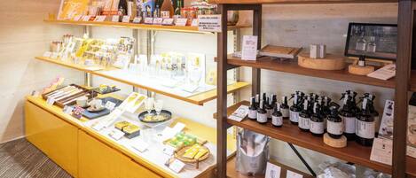 A retail display with various products on shelves and a counter.