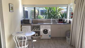 Comfort Studio Suite, 1 King Bed, Courtyard View (Adult Only) | Private kitchen | Fridge, microwave, stovetop, coffee/tea maker