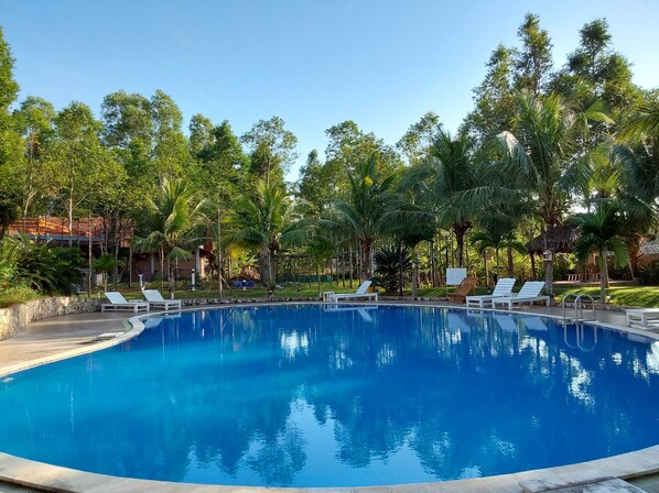 Outdoor pool, pool umbrellas, sun loungers
