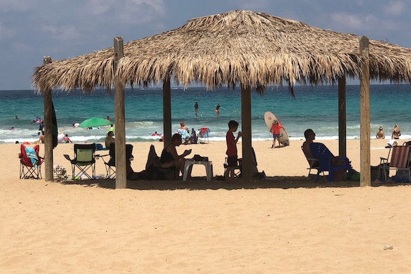 Beach nearby, white sand, beach shuttle, 2 beach bars