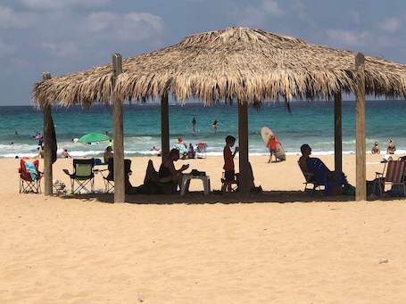 Beach nearby, white sand, beach shuttle, 2 beach bars