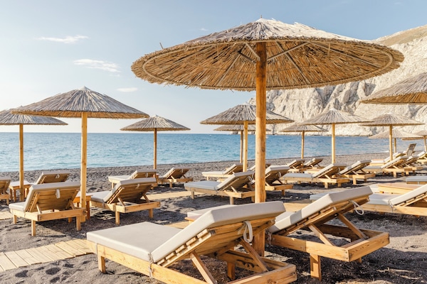 On the beach, sun loungers, beach umbrellas, beach towels