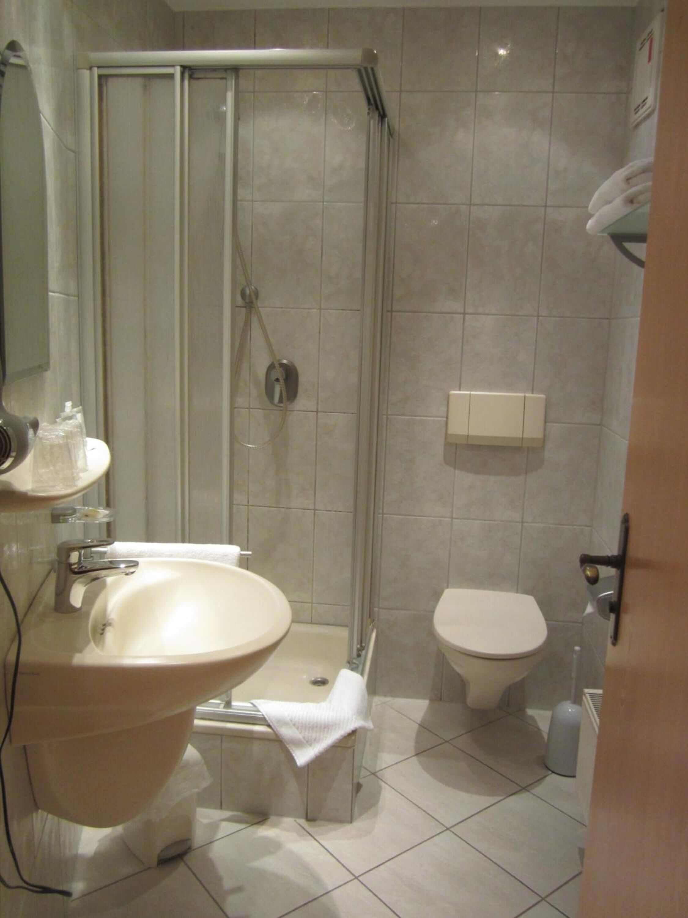 shower, free toiletries, hair dryer, towels