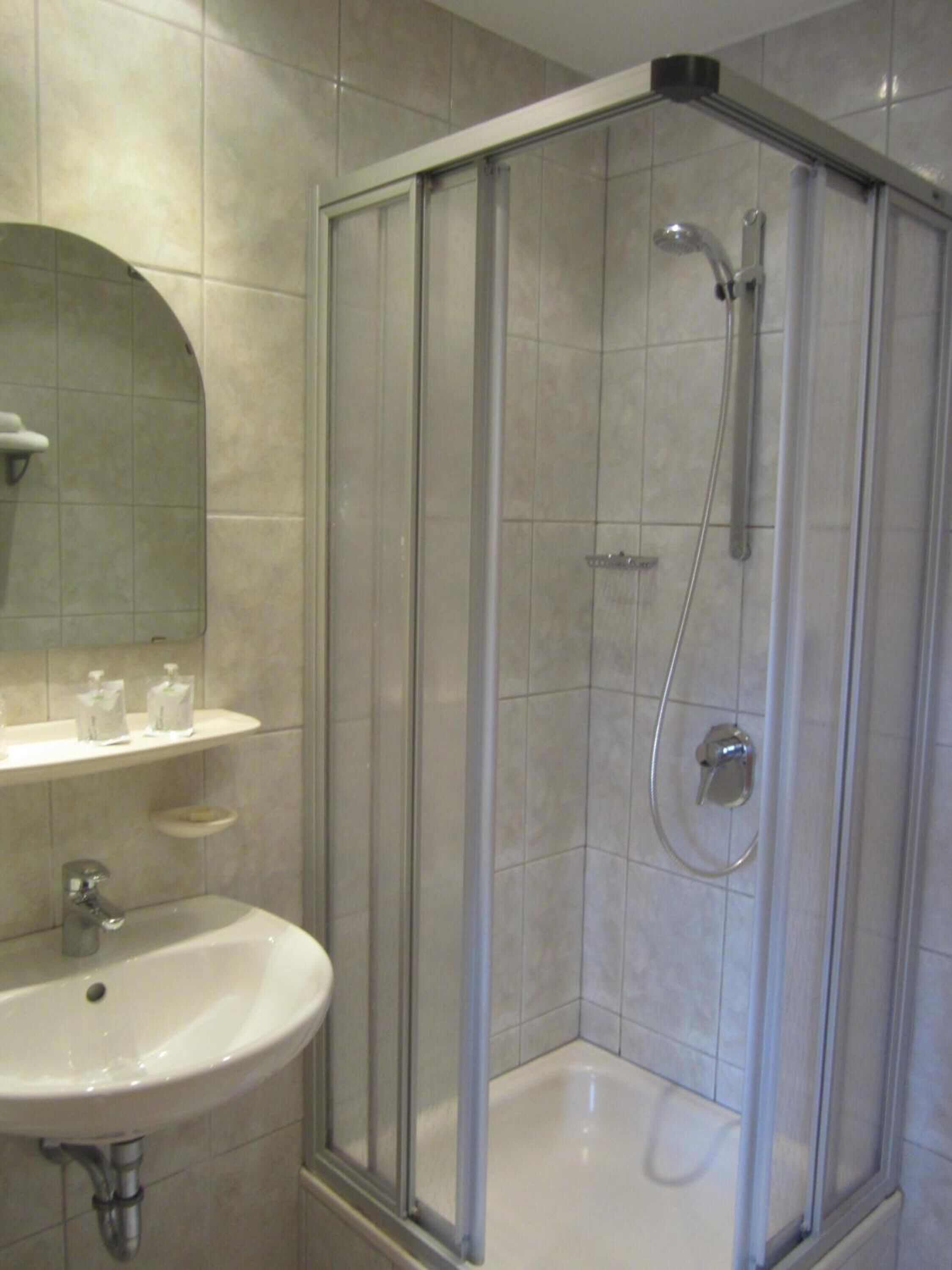 shower, free toiletries, hair dryer, towels