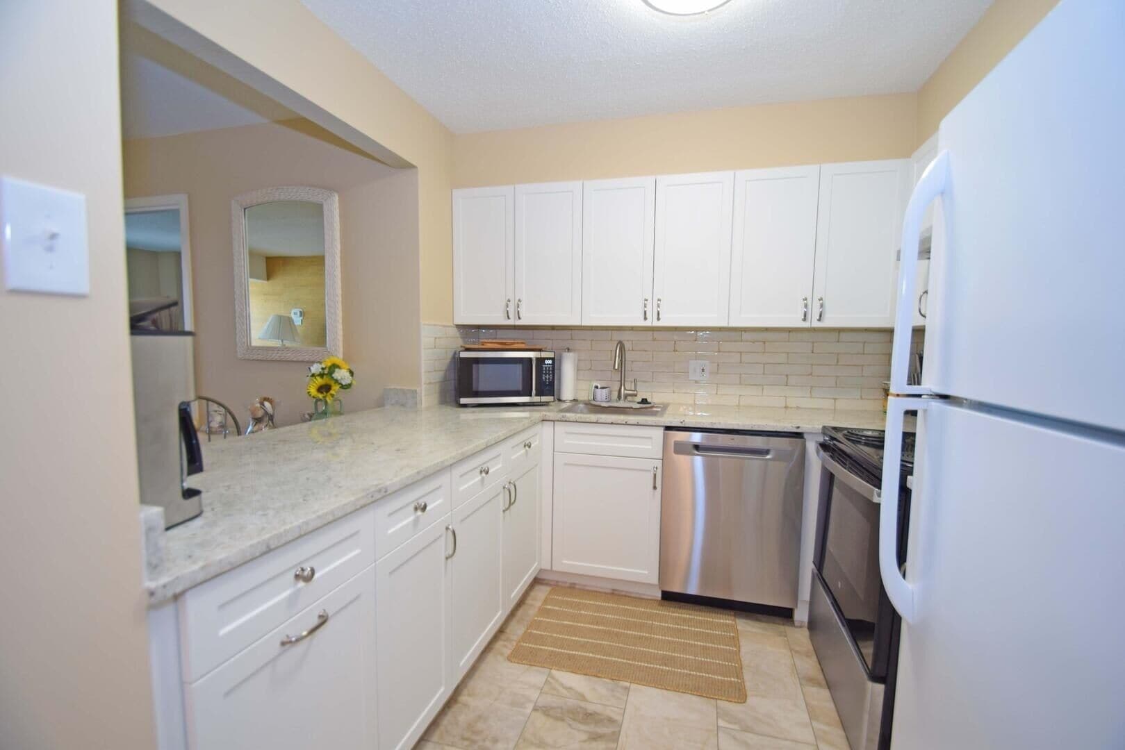 Condo, 2 Bedrooms | Private kitchen | Full-size fridge, microwave, stovetop, dishwasher