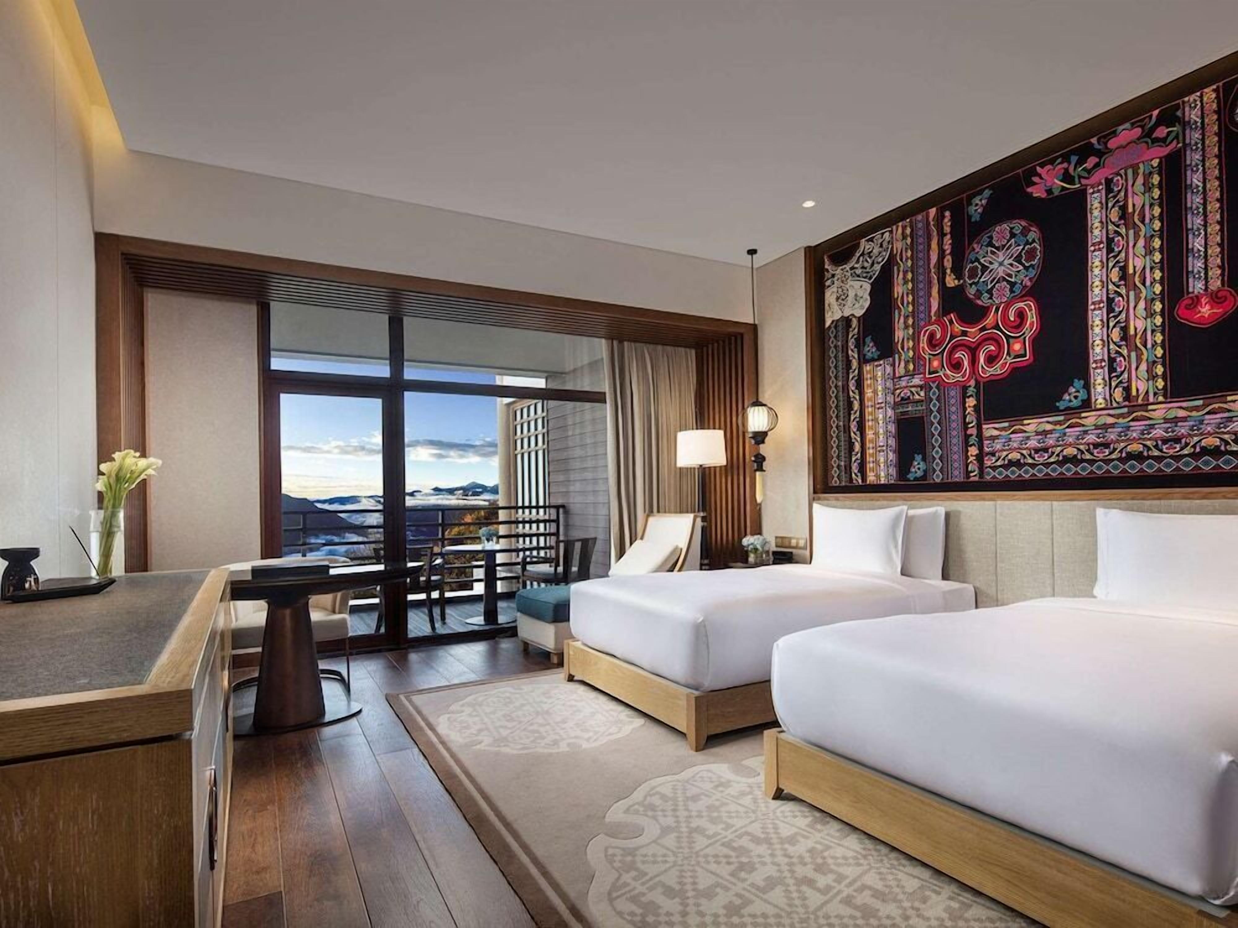 Premium bedding, down comforters, pillowtop beds, minibar