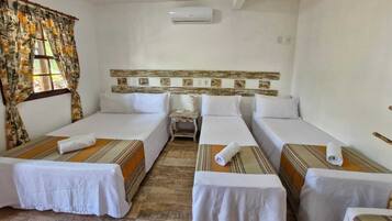 Quadruple Room | 1 bedroom, minibar, individually decorated, blackout drapes