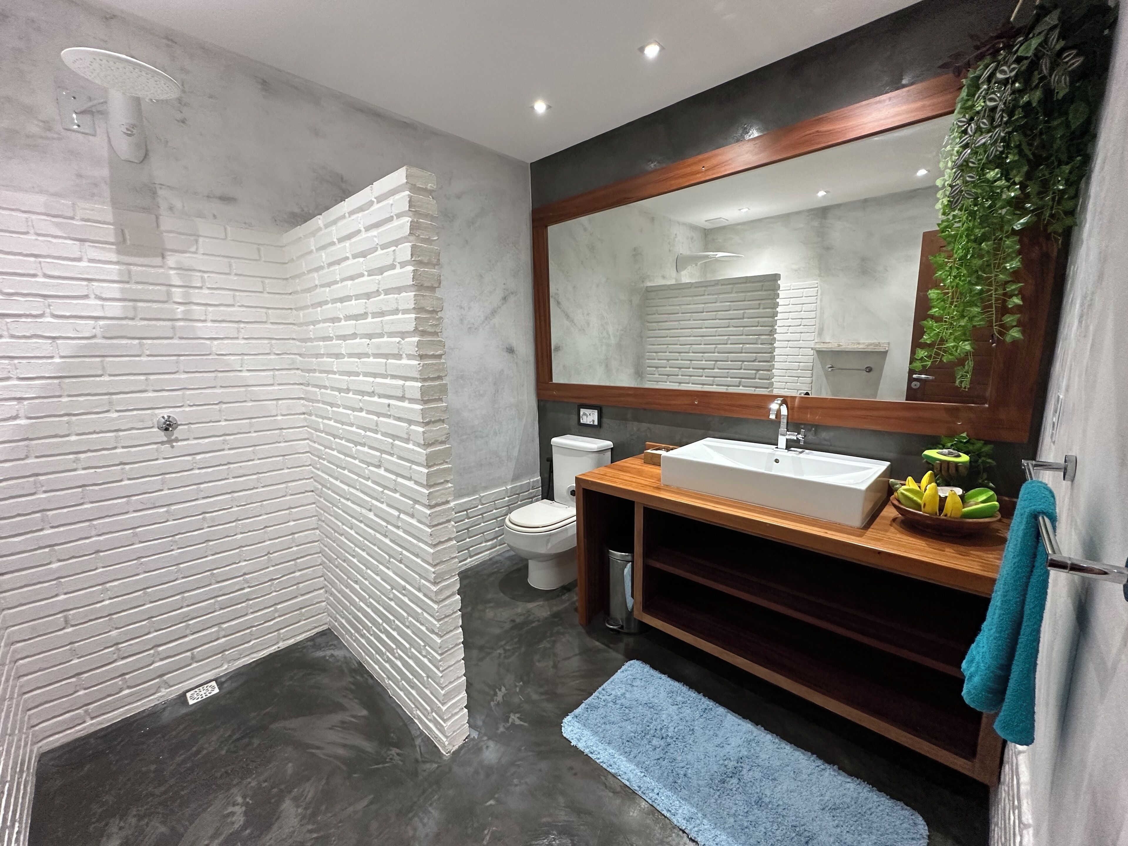 Deluxe Room, Multiple Beds | Bathroom | Shower, hair dryer, towels, soap