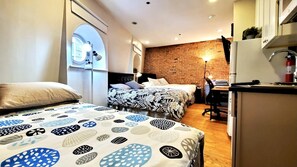 Family Studio, Multiple Beds, Kitchenette | Blackout curtains, iron/ironing board, free WiFi, bed sheets