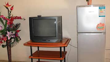 Quarto família | Área de estar | TV