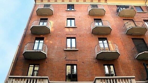 A multi-story brick building with balconies and windows. - Hotel Residence D'Azeglio (Turin)