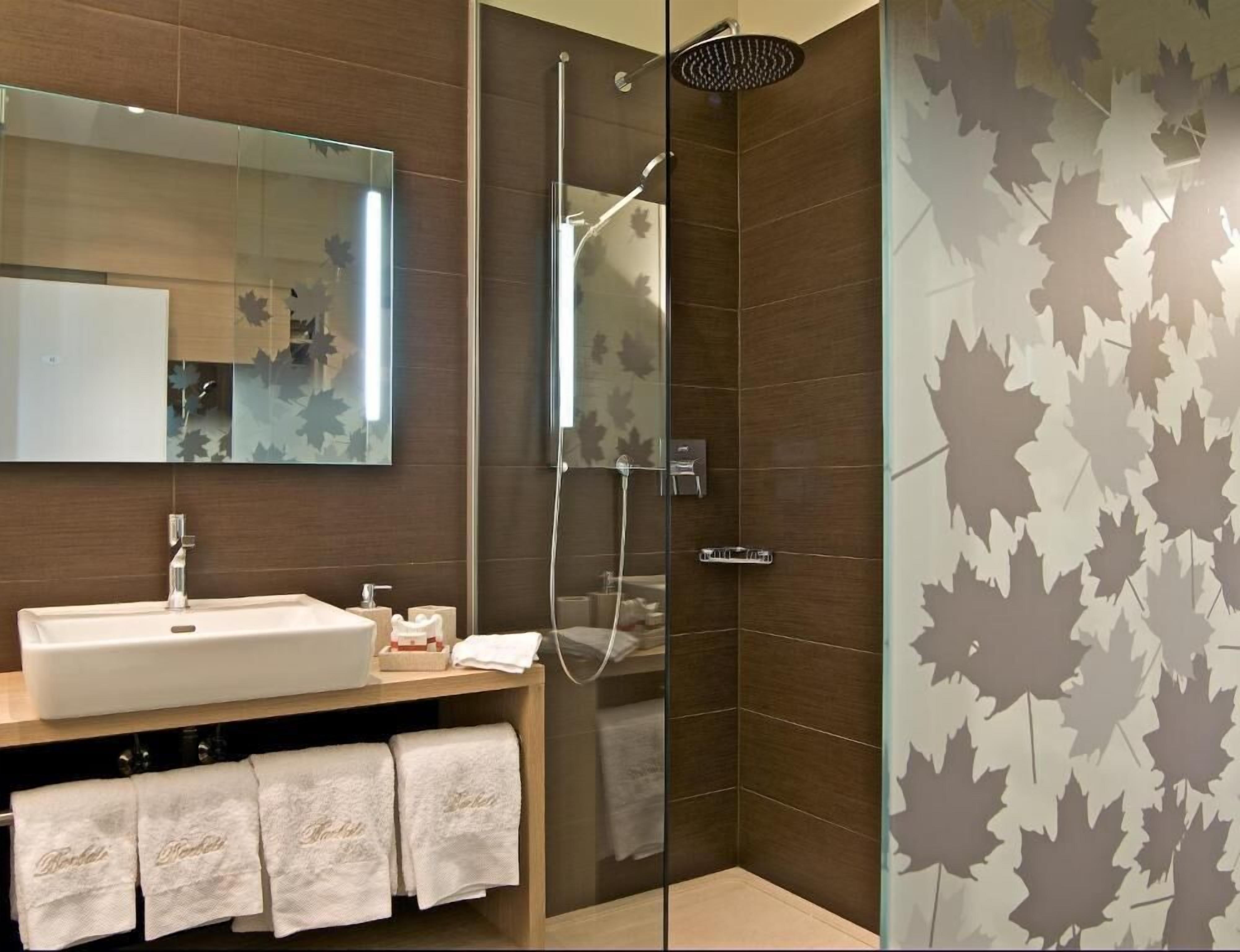 premium double room | bathroom | shower, deep-soaking bathtub, rainfall showerhead, free toiletries