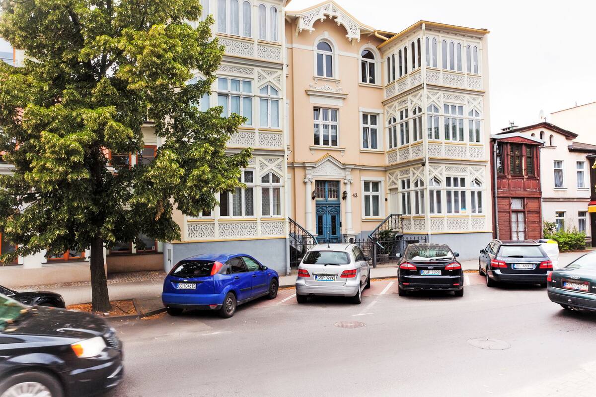 A building with a classic architectural style, featuring ornate balconies and a central entrance.
