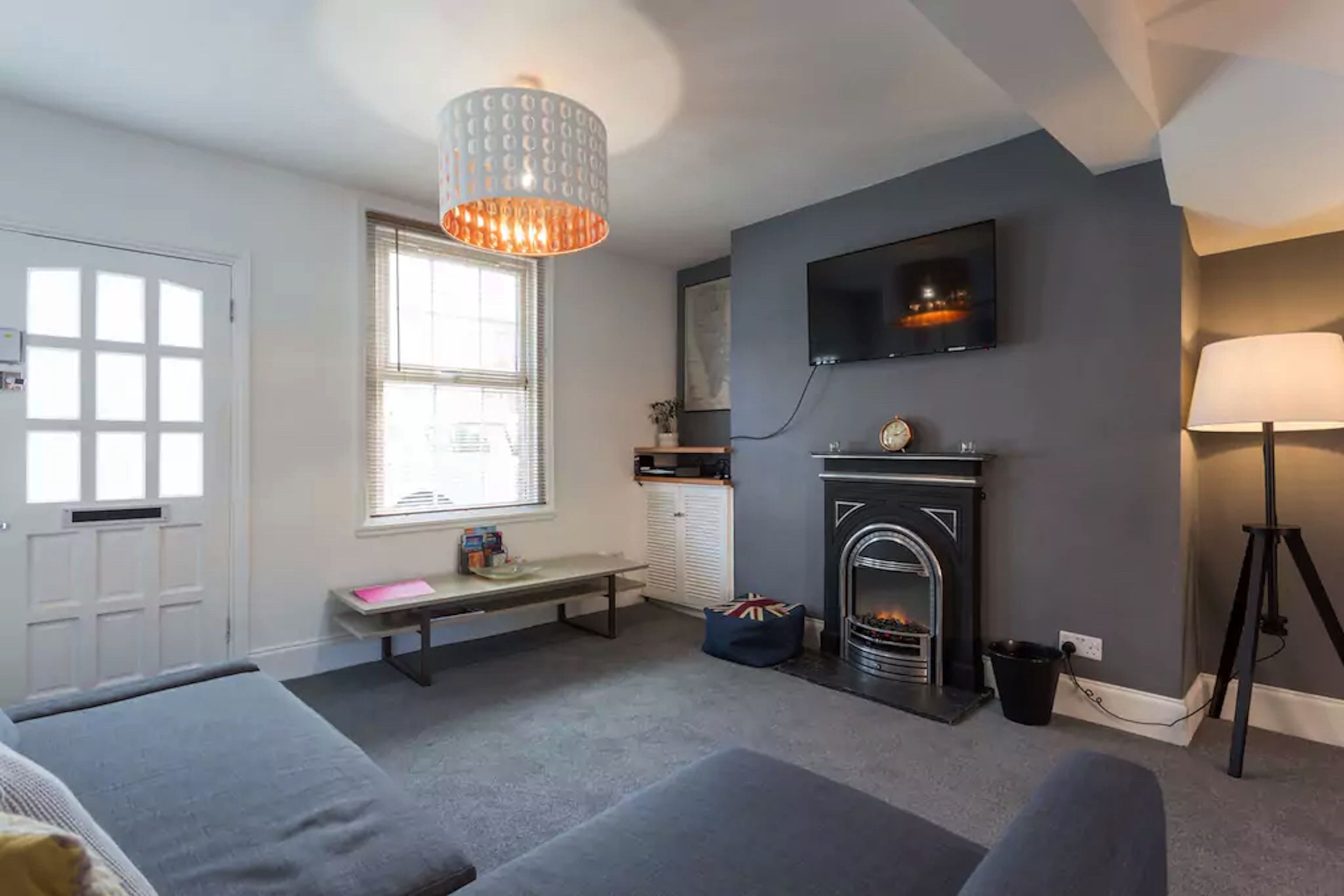 economy house (hastings house) | living room | flat-screen tv