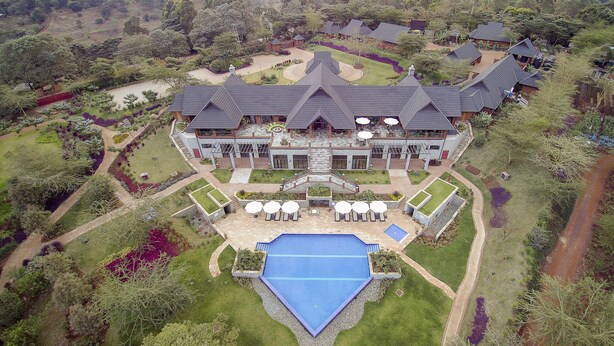 A large resort with multiple guest rooms, a swimming pool, and a well-maintained garden. - The Retreat at Ngorongoro (Karatu)