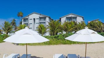 On the beach, sun loungers, beach umbrellas, beach towels