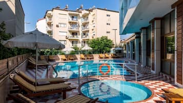 Outdoor pool, pool umbrellas, sun loungers