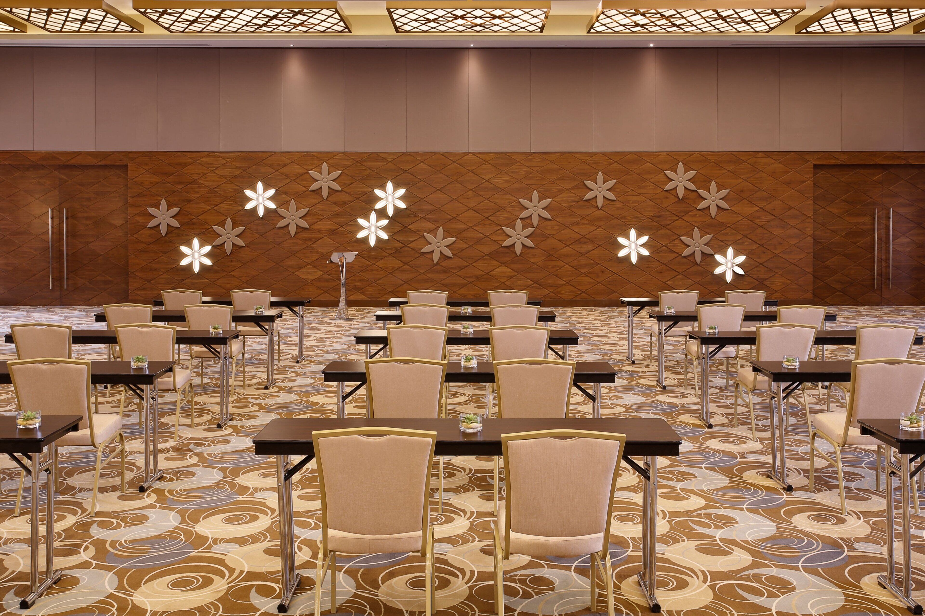 A conference room with tables and chairs arranged for a meeting.