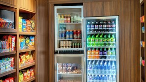 A vending machine stocked with snacks and drinks.
