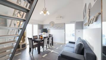 Deluxe Apartment, 2 Bedrooms | Living area | TV, table tennis