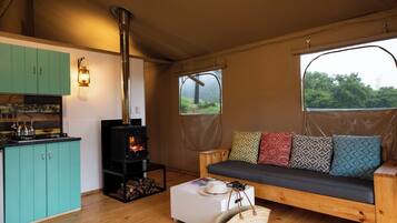 Luxury Tent, 2 Bedrooms | Living area | Fireplace