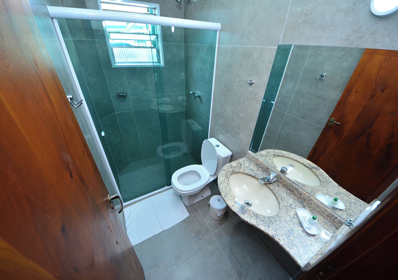 deluxe room | bathroom | shower, hair dryer