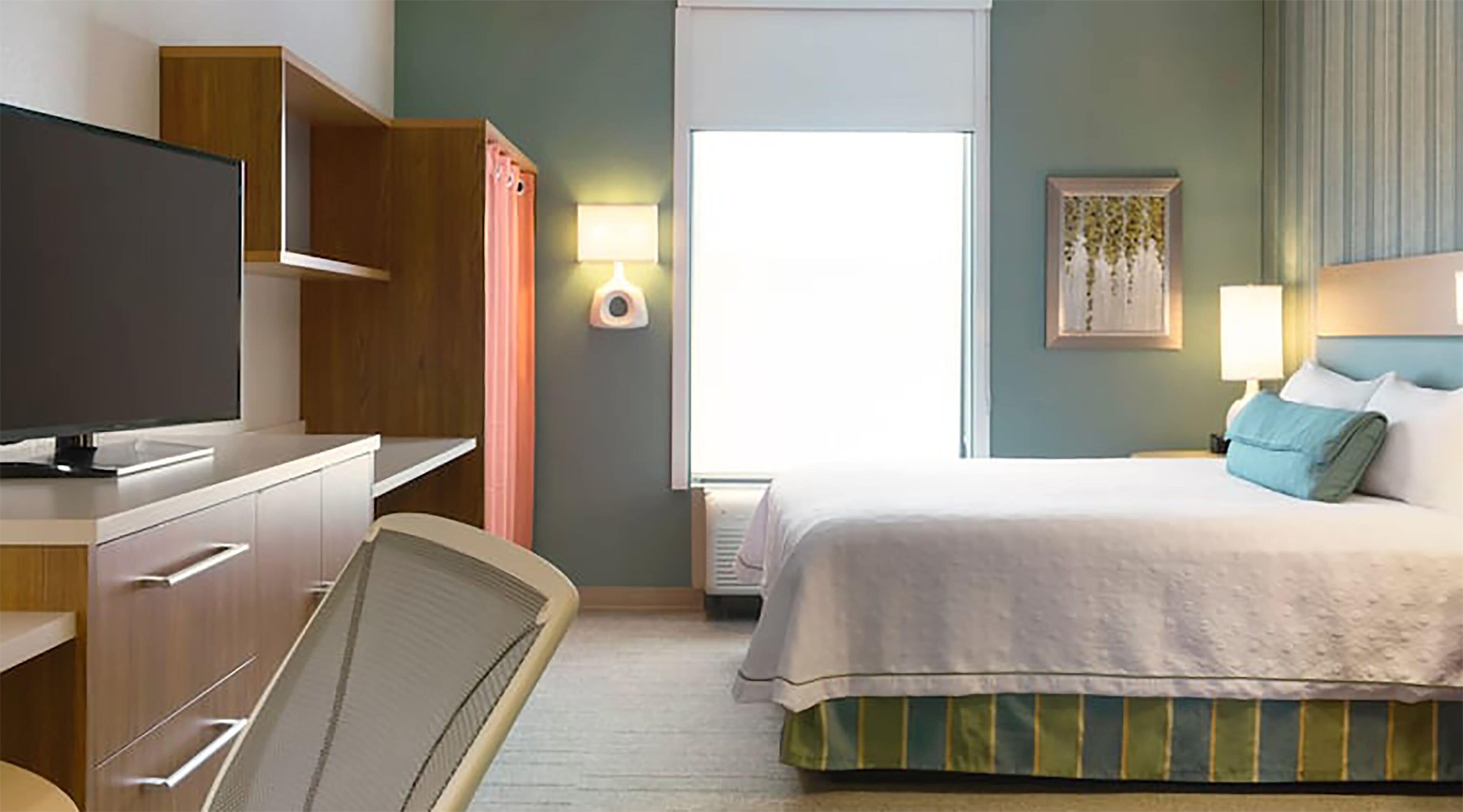 desk, blackout curtains, iron/ironing board, free cots/infant beds