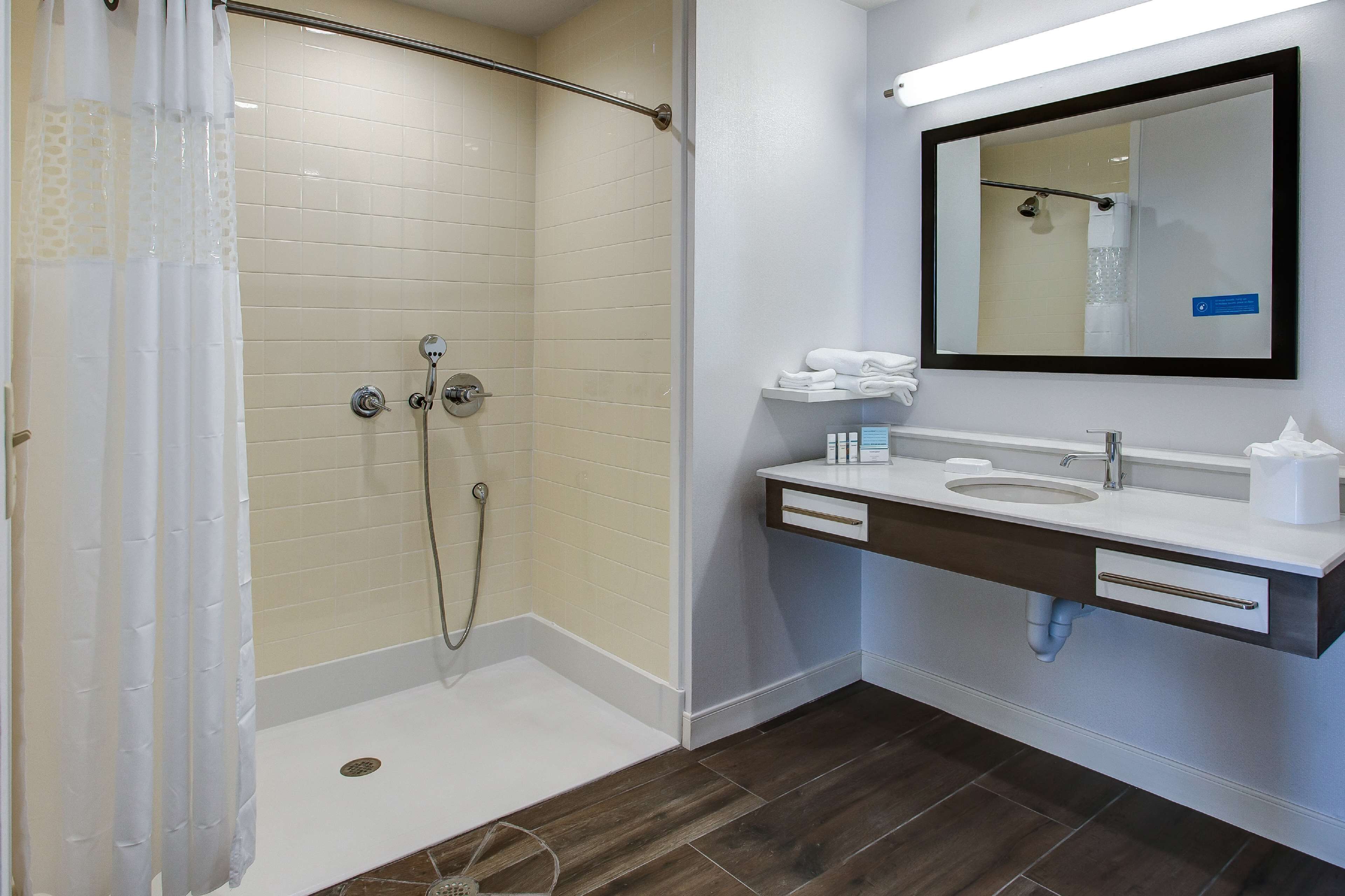studio, 1 king bed, accessible, non smoking (w/ roll-in shower) | bathroom | combined shower/bathtub, free toiletries, towels