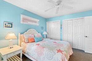 A bedroom with a bed, two bedside tables, a ceiling fan, and a window with blinds. - Majak Moments 7 Bedroom Home by RedAwning (Supply)