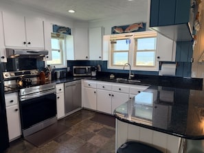 House, 4 Bedrooms | Private kitchen | Coffee/tea maker, full-sized fridge, microwave, oven - Windchimes 4 Bedroom Home by RedAwning (Supply)