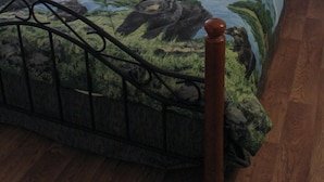 A bedroom with a bed, a nightstand, a lamp, and a painting on the wall. - Whispering Winds Retreat B&B (Ninilchik)