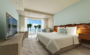 A modern hotel room with a large bed, a flat-screen TV, a balcony with a view of palm trees and the sea, and a wooden headboard.