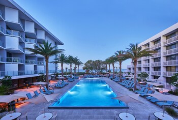 Outdoor pool, sun loungers at Zota Beach Resort
