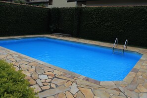 Outdoor pool, pool umbrellas, pool loungers