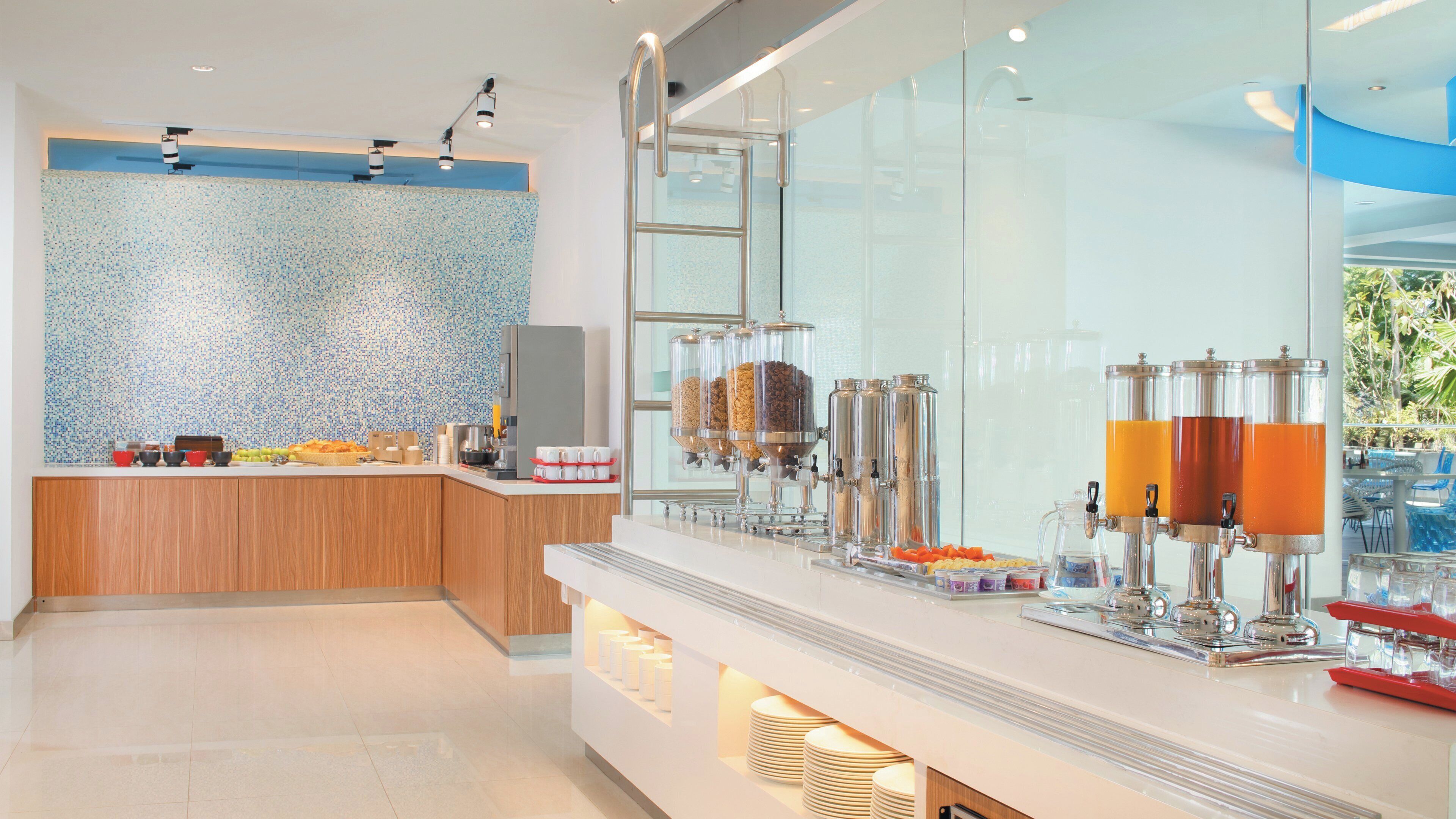 A modern breakfast bar with a tiled backsplash, a wooden counter, and a glass partition.