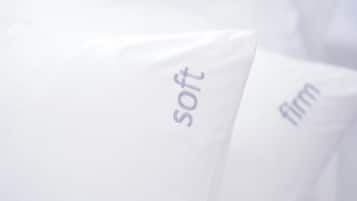 Pillows with embroidered text.