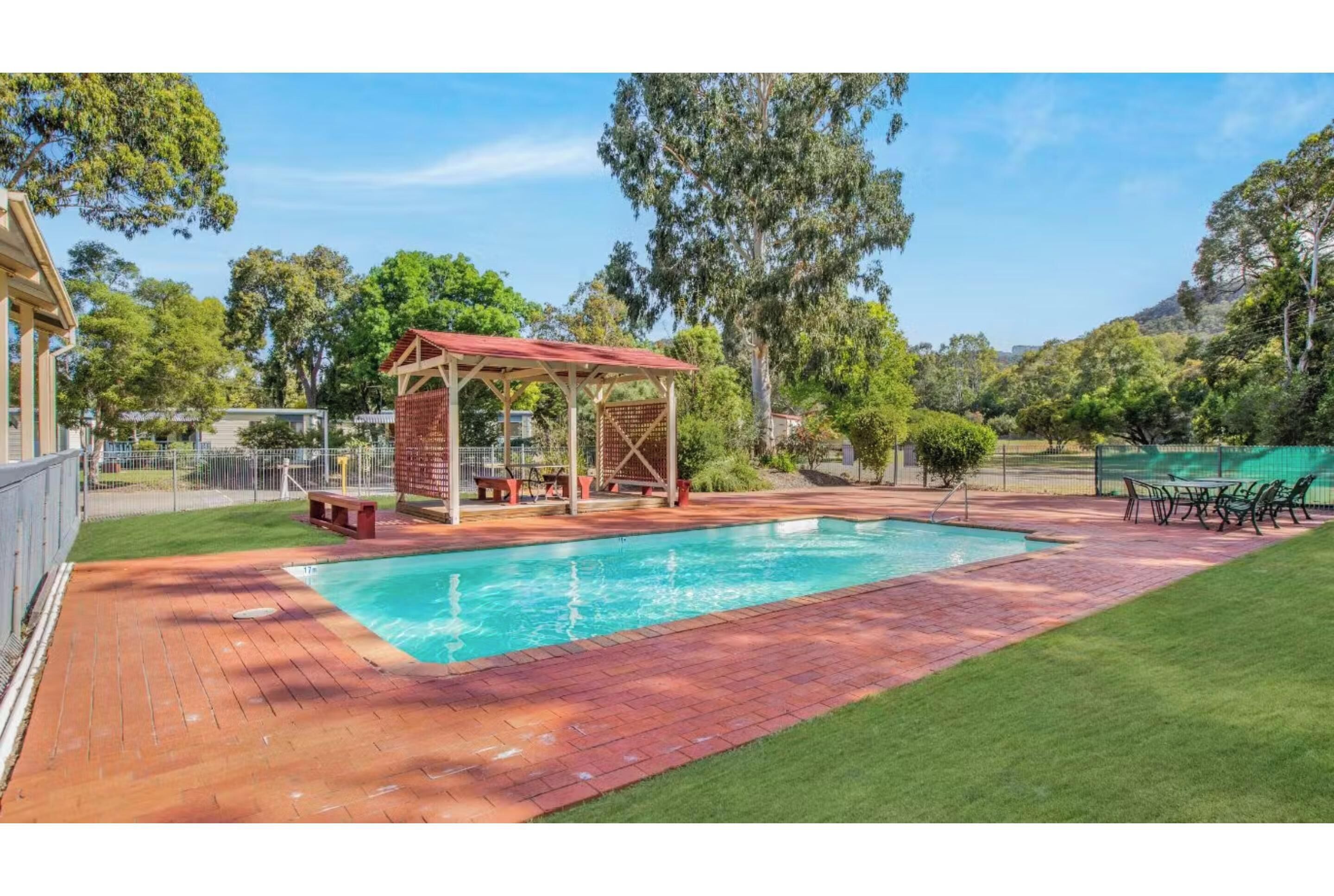 Seasonal outdoor pool, open 10:00 AM to 8:00 PM, pool loungers