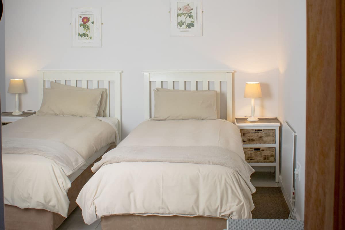 Twin Room, Garden View | Down comforters, individually decorated, individually furnished
