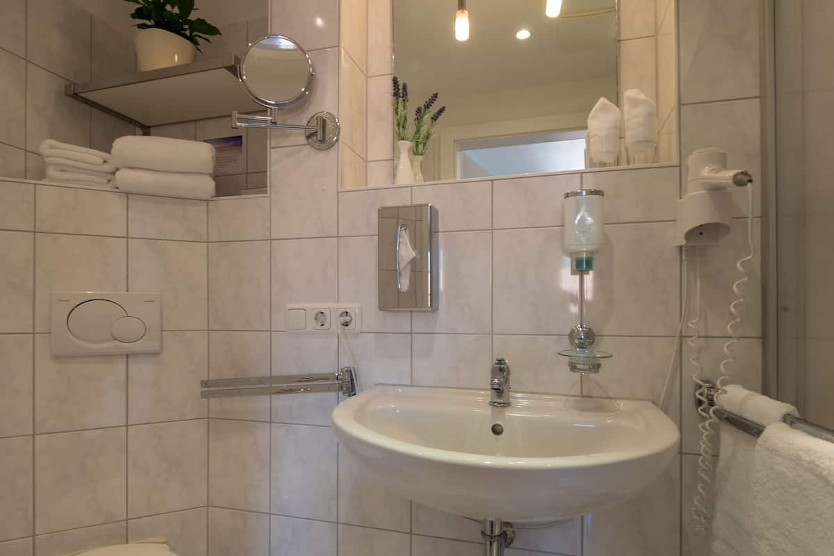 standard double room (in main or annex building) | bathroom | shower, hair dryer, towels