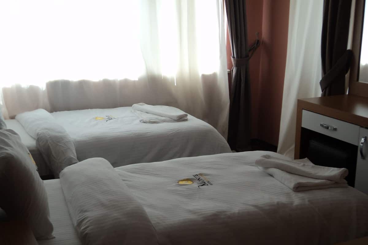 Standard Twin Room, Partial Sea View | Minibar, free WiFi