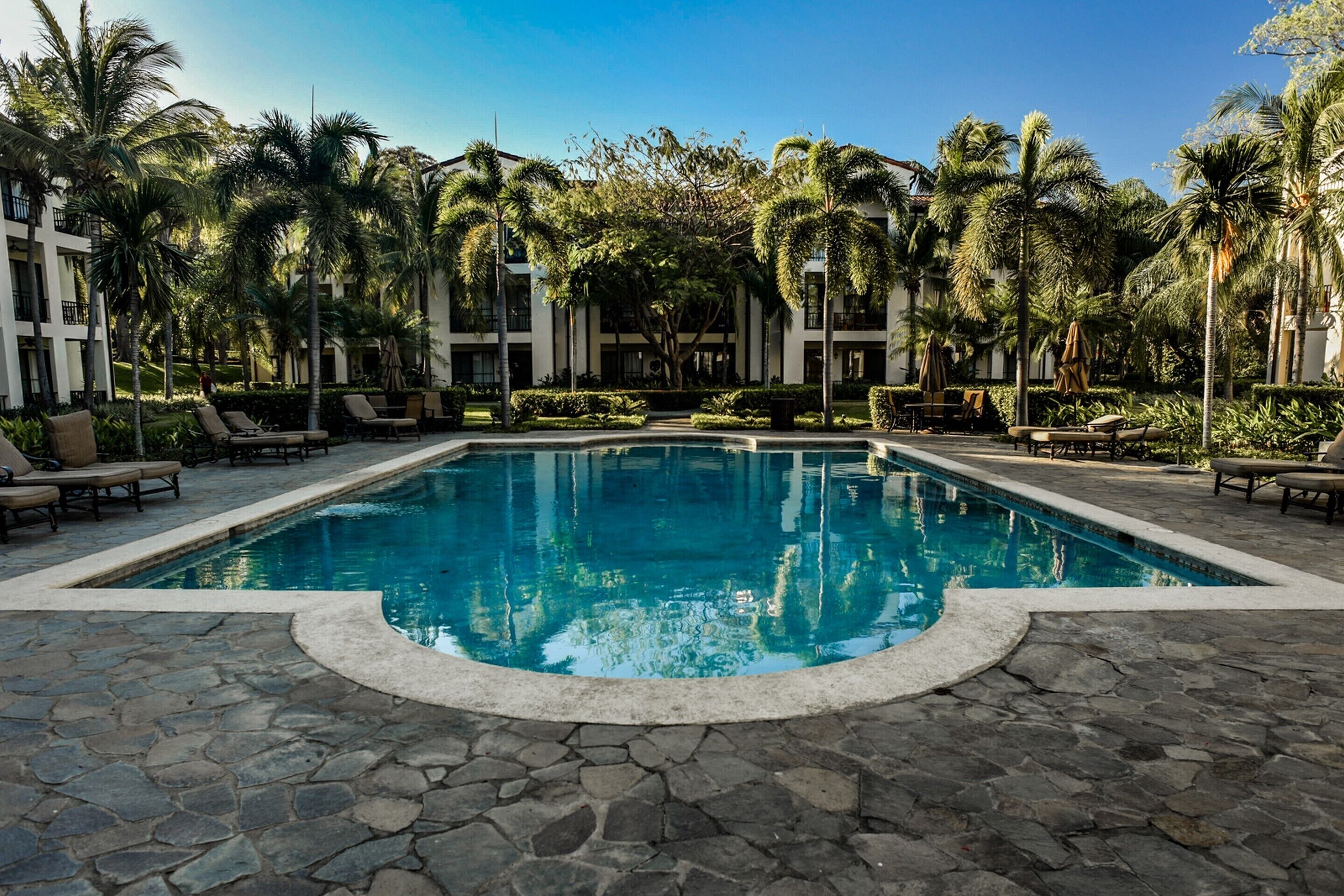 4 outdoor pools, open 6:00 AM to 10:00 PM, pool umbrellas, sun loungers