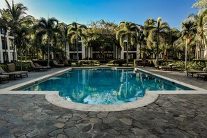 4 outdoor pools, open 6:00 AM to 10:00 PM, pool umbrellas, sun loungers