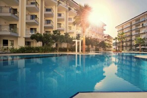 2 outdoor pools, pool umbrellas, pool loungers