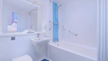 A bathroom with a white sink, toilet, and bathtub.
