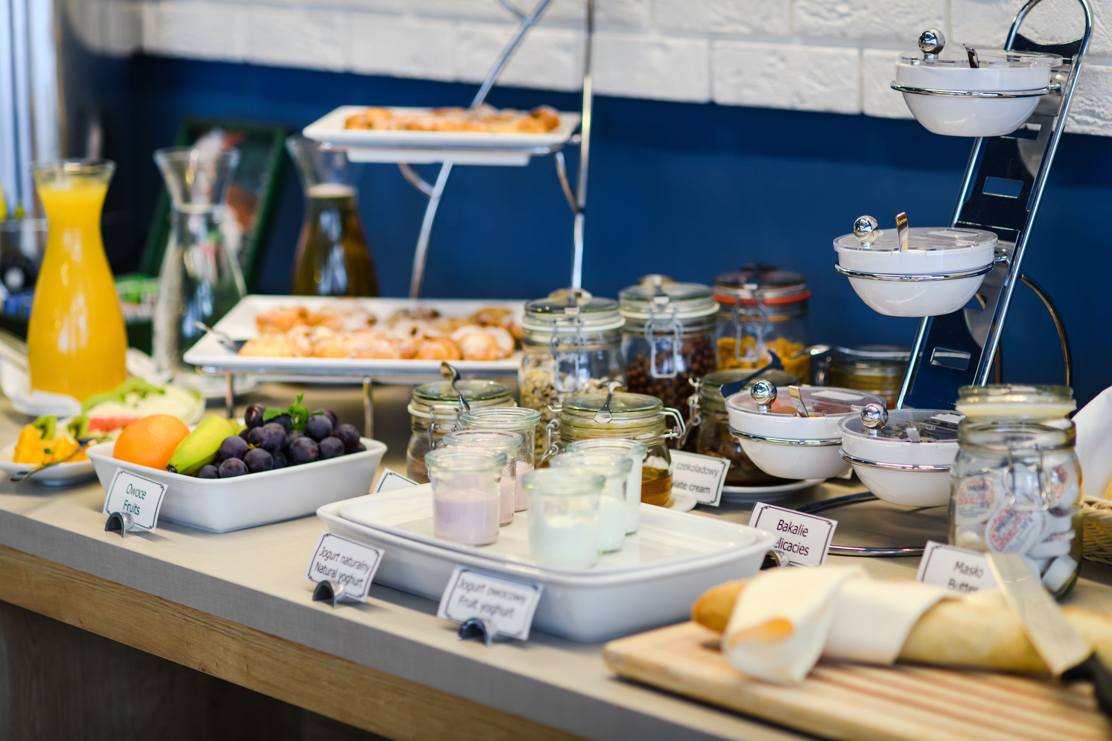 A buffet with various food items and beverages.