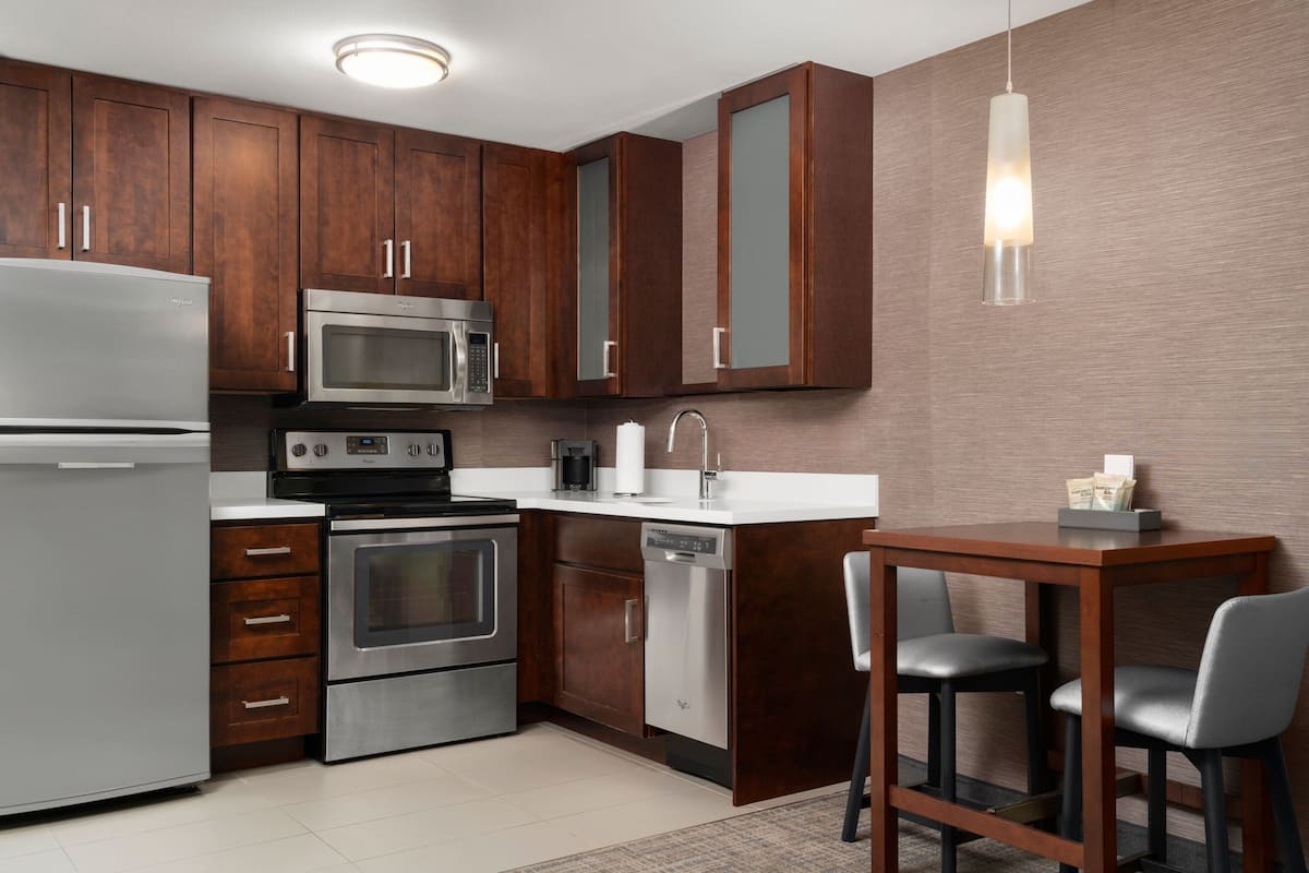 full-sized fridge, microwave, stovetop, dishwasher