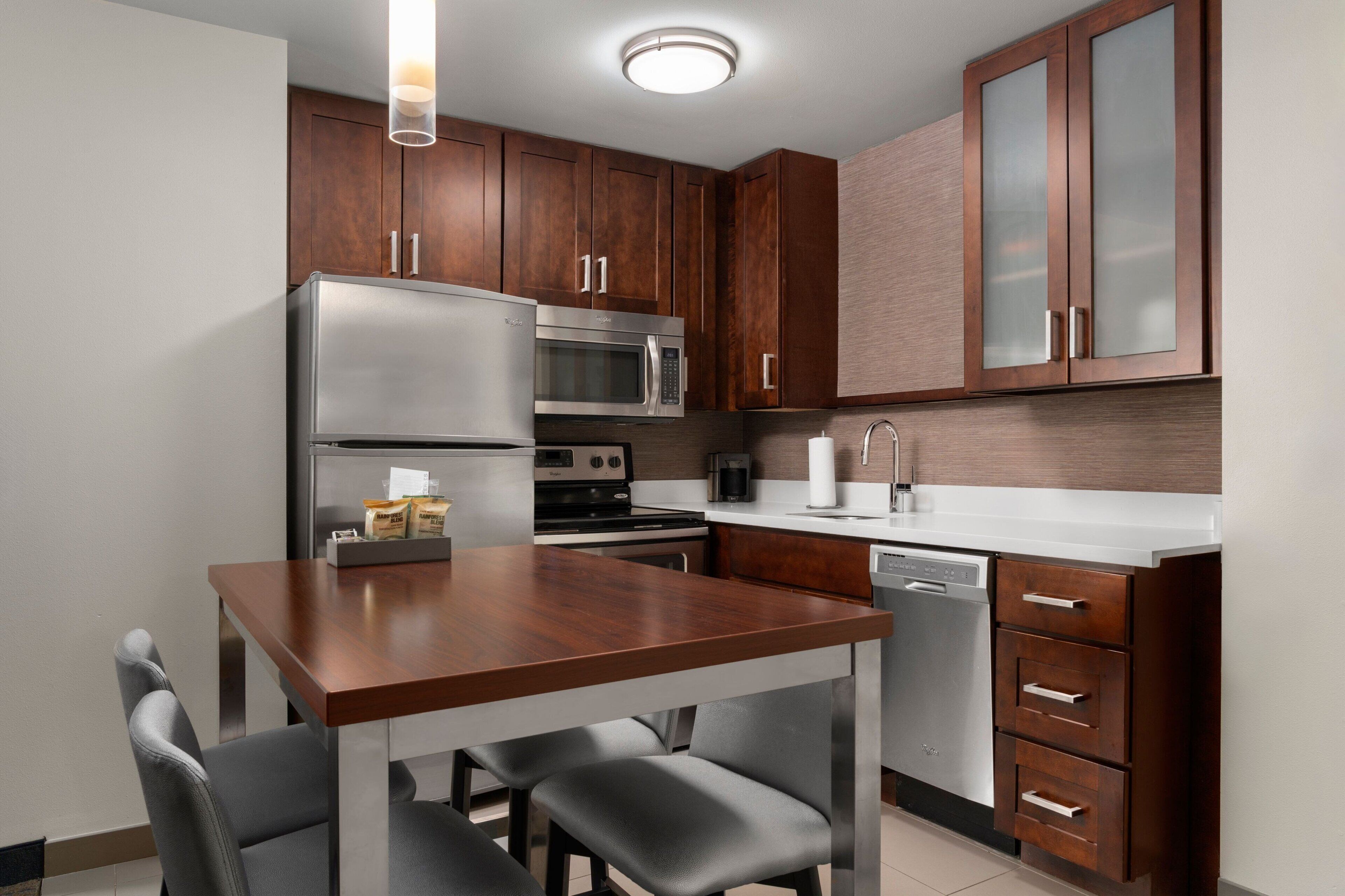 full-sized fridge, microwave, stovetop, dishwasher