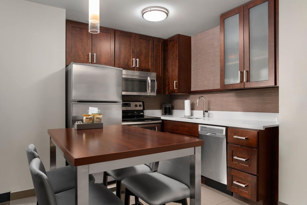 full-sized fridge, microwave, stovetop, dishwasher