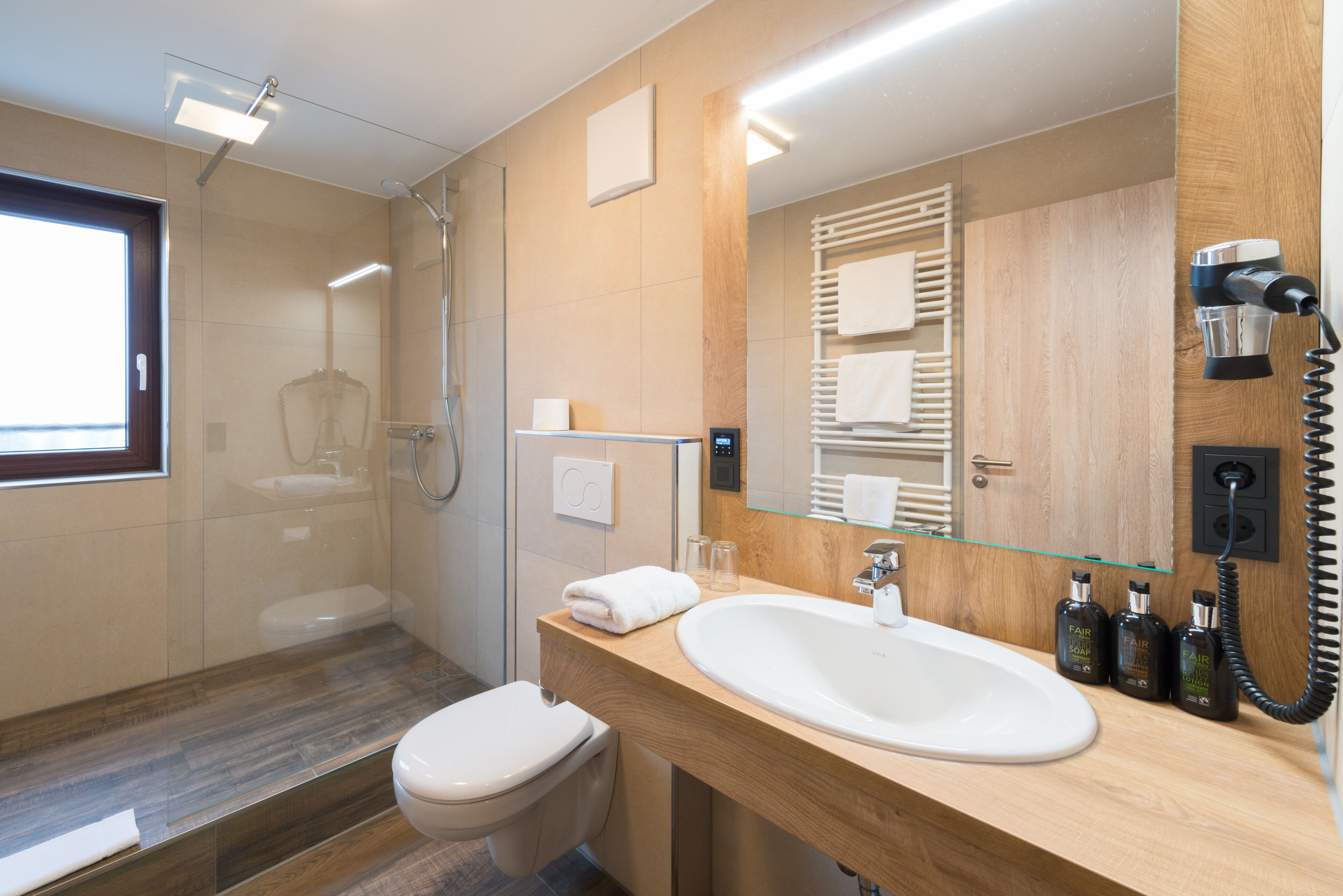 comfort double room | bathroom amenities | shower, free toiletries, hair dryer, towels