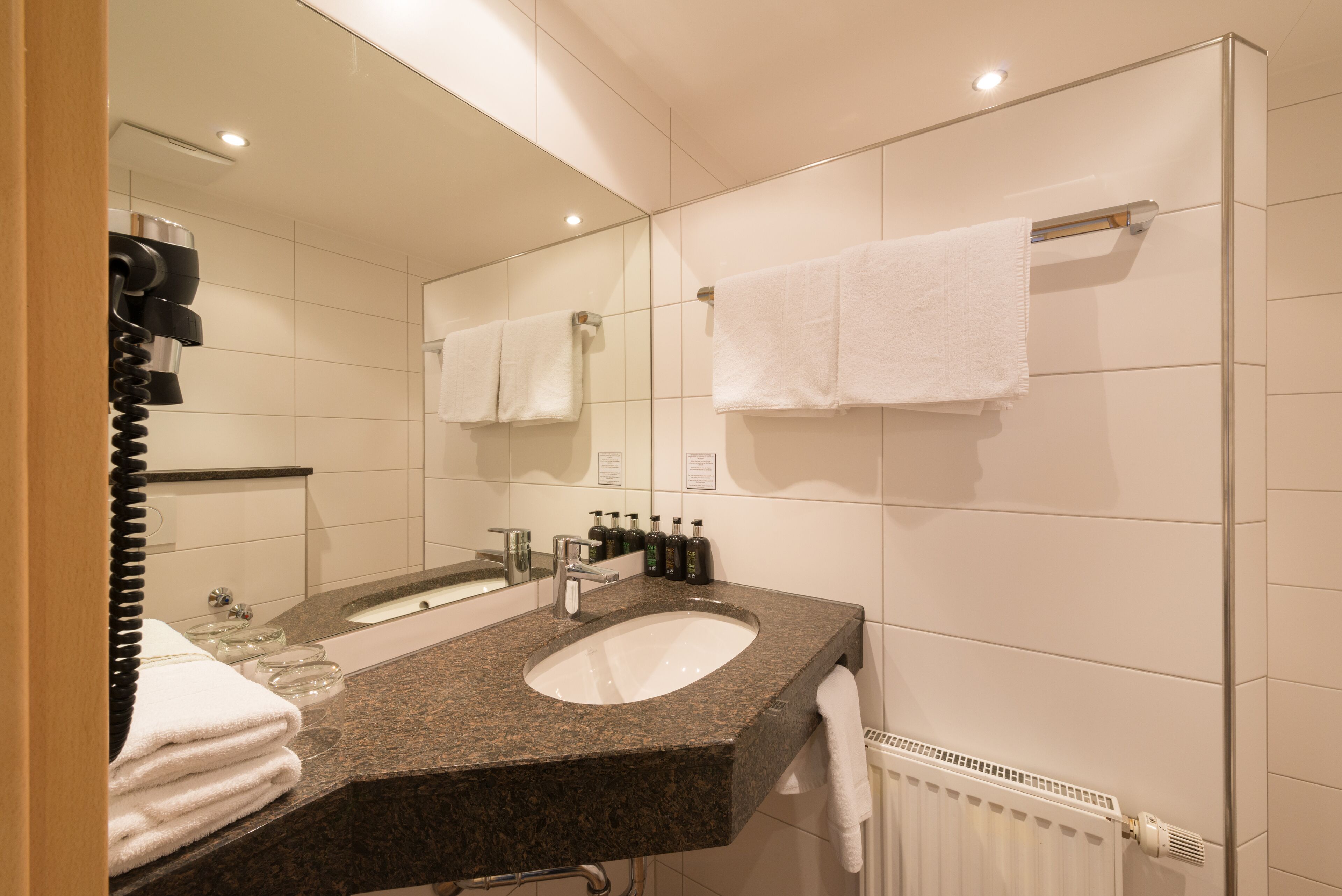 deluxe quadruple room | bathroom amenities | shower, free toiletries, hair dryer, towels